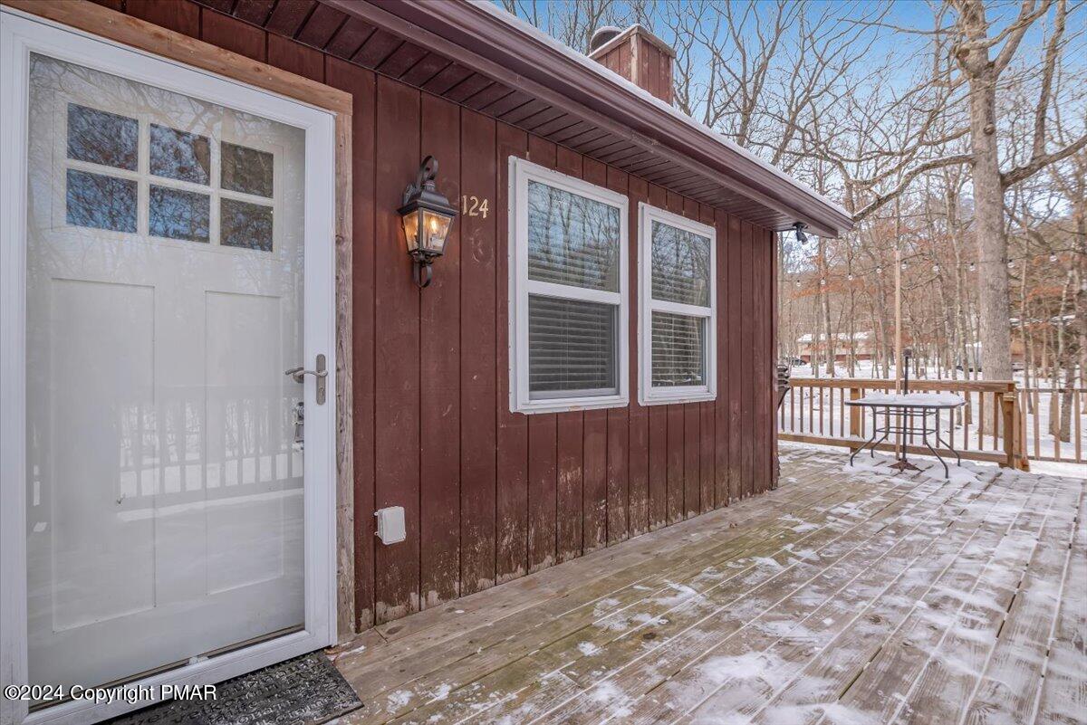124 Rabbit Court Bushkill, PA 18324 - Photo 9 of 44 a view of a house with a large window and wooden fence