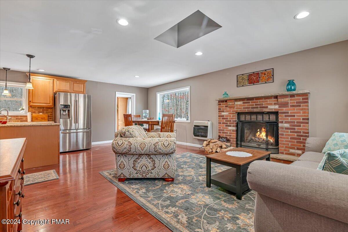 124 Rabbit Court Bushkill, PA 18324 - Photo 10 of 44 a living room with furniture fireplace and a table