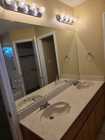 a bathroom with a sink and mirror