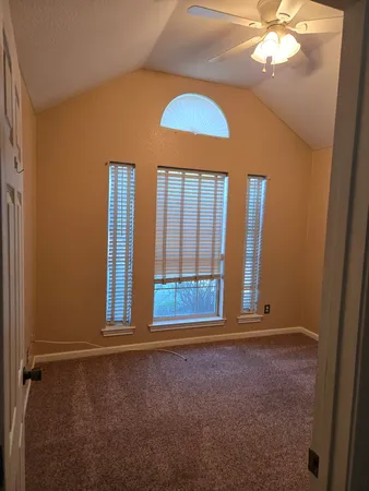 wooden floor and window in an empty room