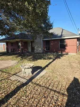 a view of a house with swimming pool in front of main door