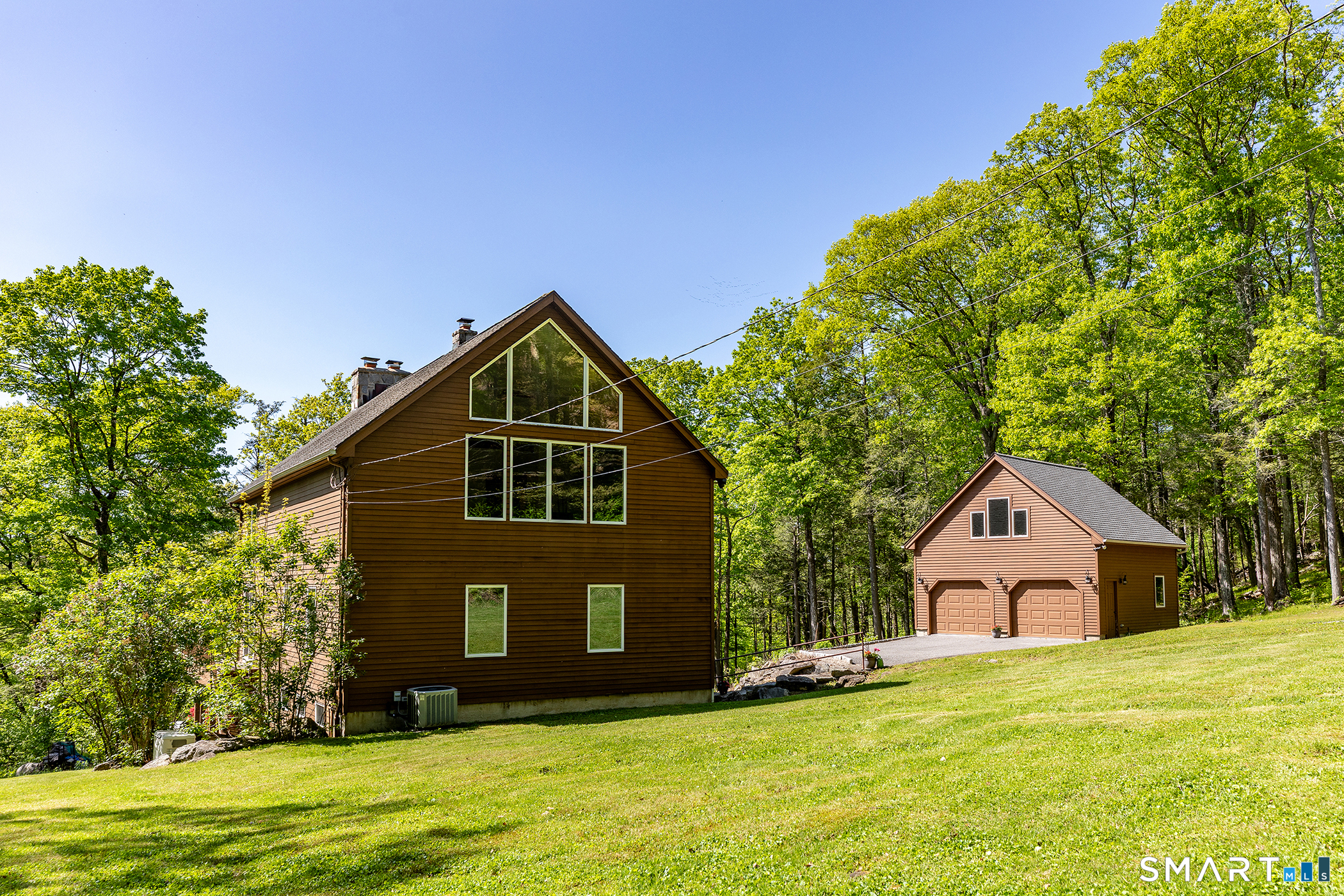 3 Old Forest Road Sherman, CT 06784 - Photo 37 of 38 a front view of a house with a yard and garage