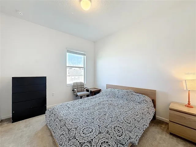 a bedroom with a bed and a closet