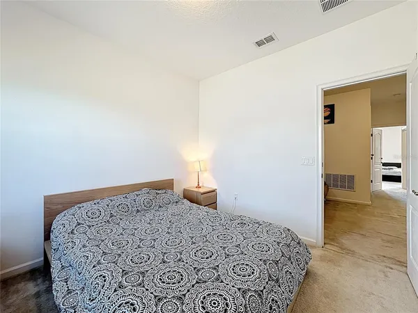 a bedroom with a bed and a table in it