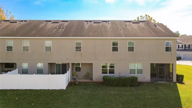 a aerial view of a house with a yard