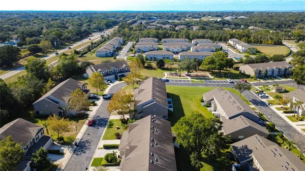 an aerial view of residential houses with outdoor space