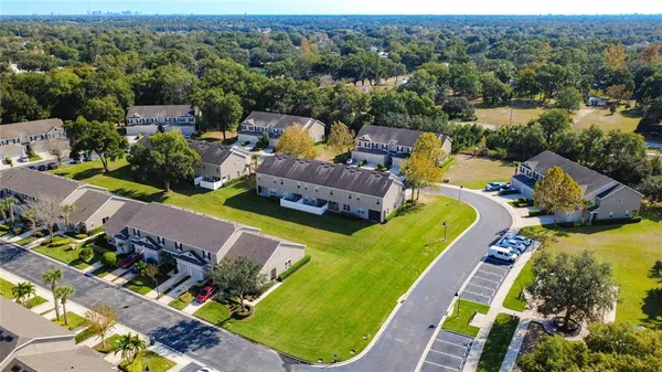 an aerial view of a swimming pool patio and mountain view
