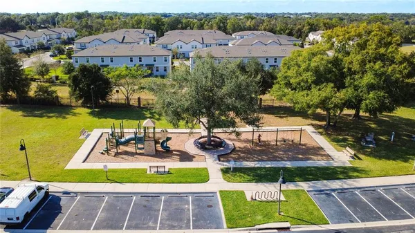 a view of a big yard with potted plants