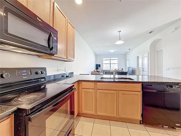 a kitchen with a stove and a sink