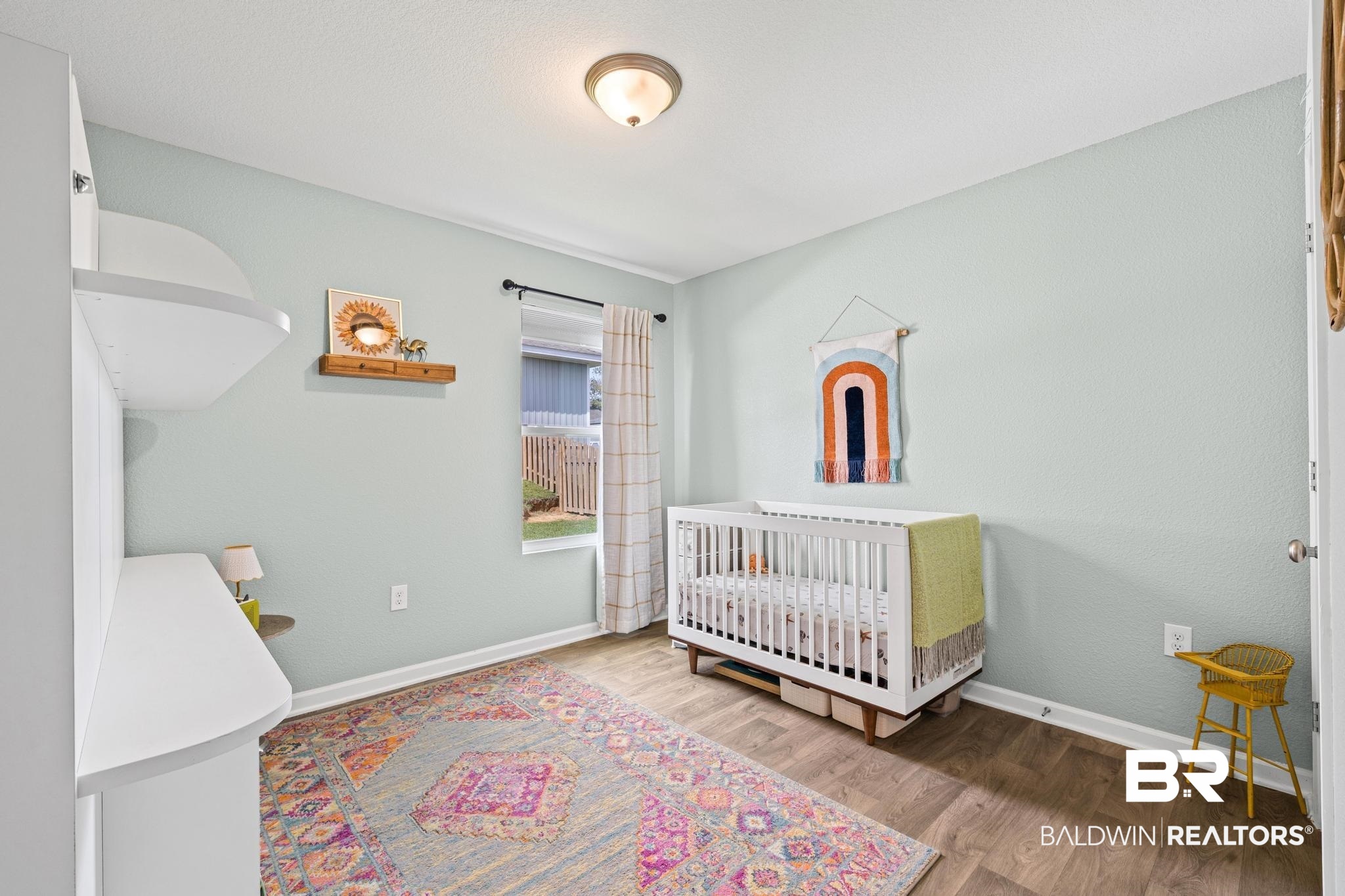 3078 Camino Real Loop Lillian, AL 36549 - Photo 19 of 51 Bedroom featuring a nursery area and light wood-style floors