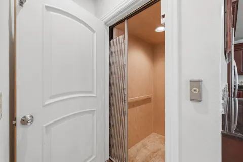a view of a bathroom from a hallway