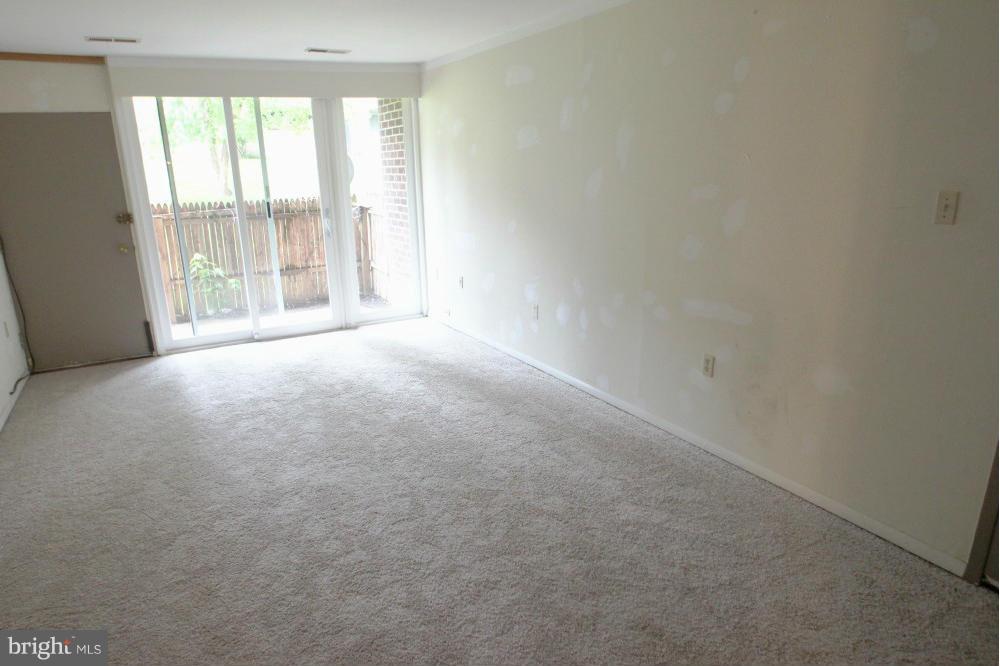 3934 Bel Pre Road, Unit 1 Silver Spring, MD 20906 - Photo 2 of 12 an empty room with a window
