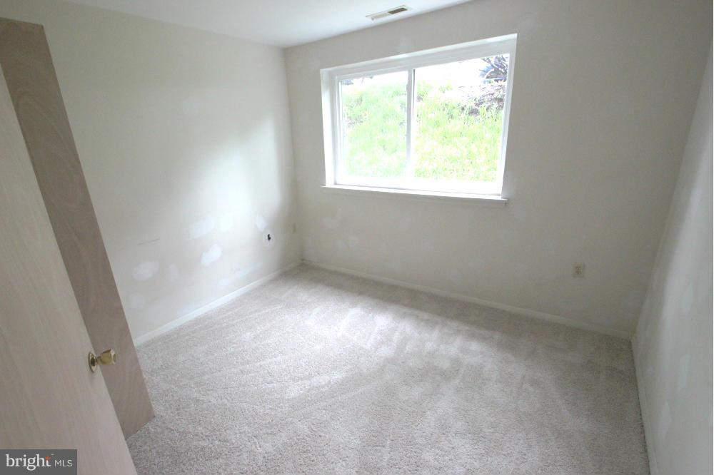 3934 Bel Pre Road, Unit 1 Silver Spring, MD 20906 - Photo 11 of 12 an empty room with a window
