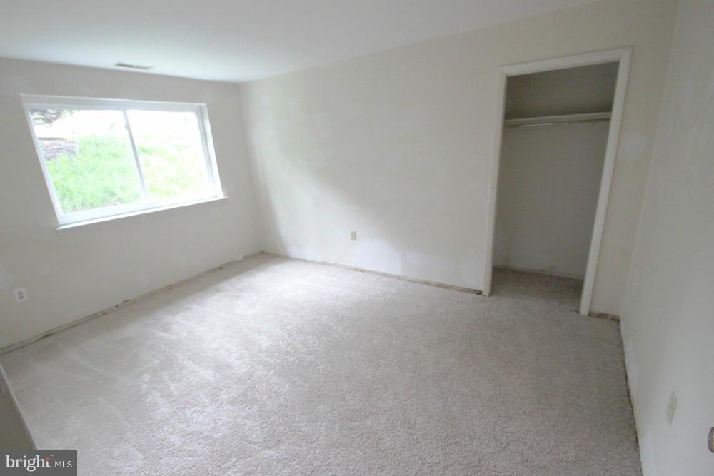 3934 Bel Pre Road, Unit 1 Silver Spring, MD 20906 - Photo 12 of 12 an empty room with a window