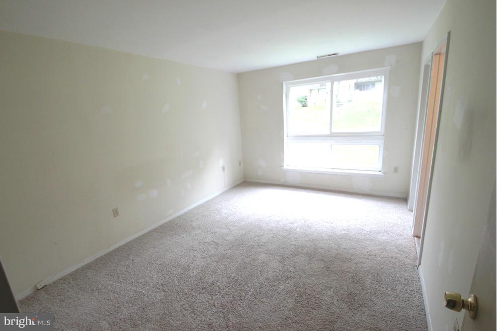 3934 Bel Pre Road, Unit 1 Silver Spring, MD 20906 - Photo 9 of 12 an empty room with a window