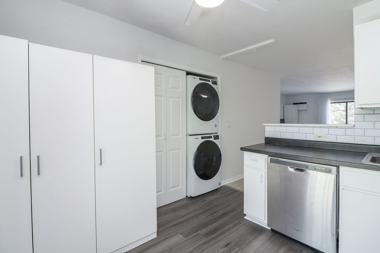 201 North Waters Edge Drive, Unit 302 Glendale Heights, IL 60139 - Photo 14 of 18 a kitchen with a washer and dryer