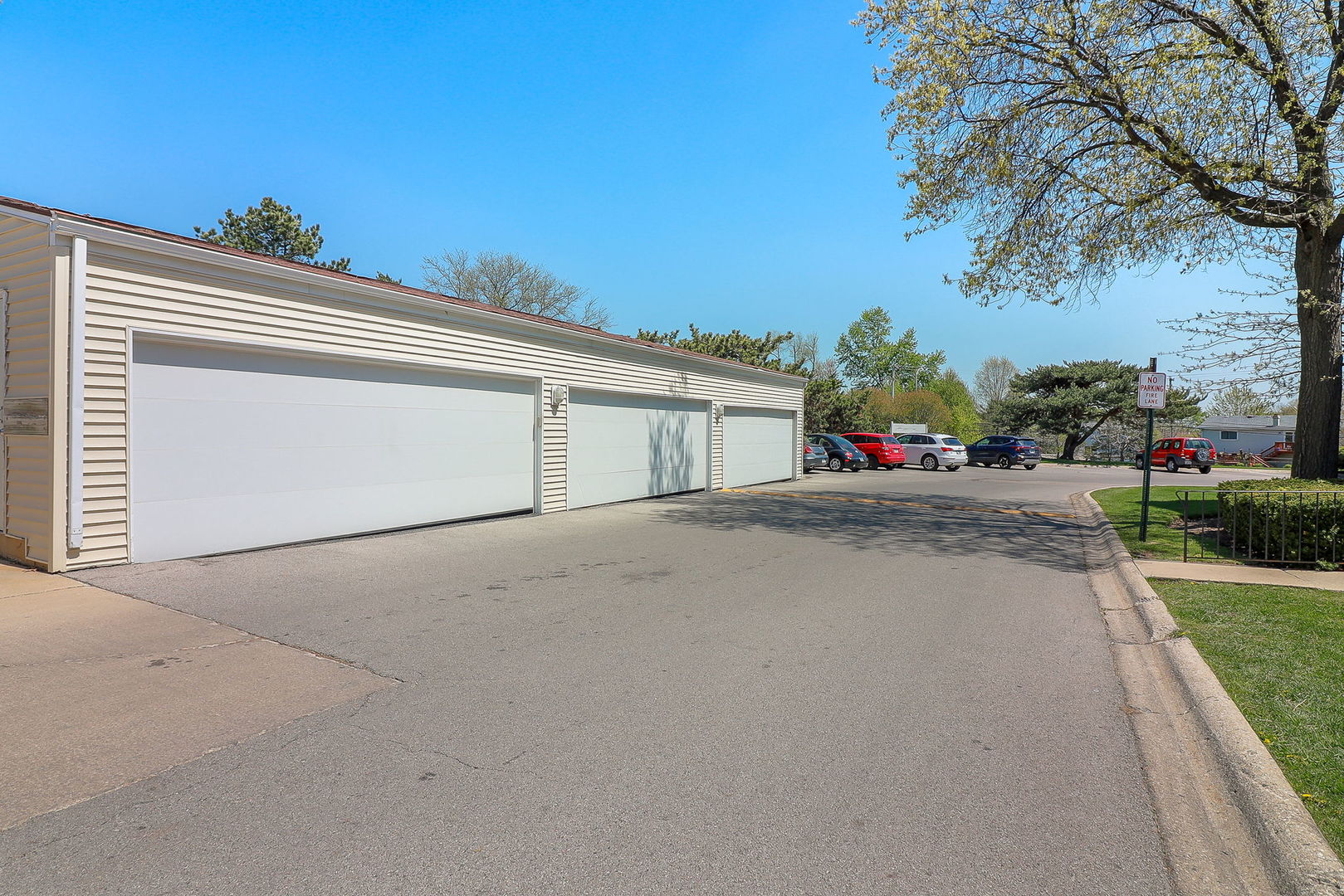 201 North Waters Edge Drive, Unit 302 Glendale Heights, IL 60139 - Photo 18 of 18 front view of a house with a street