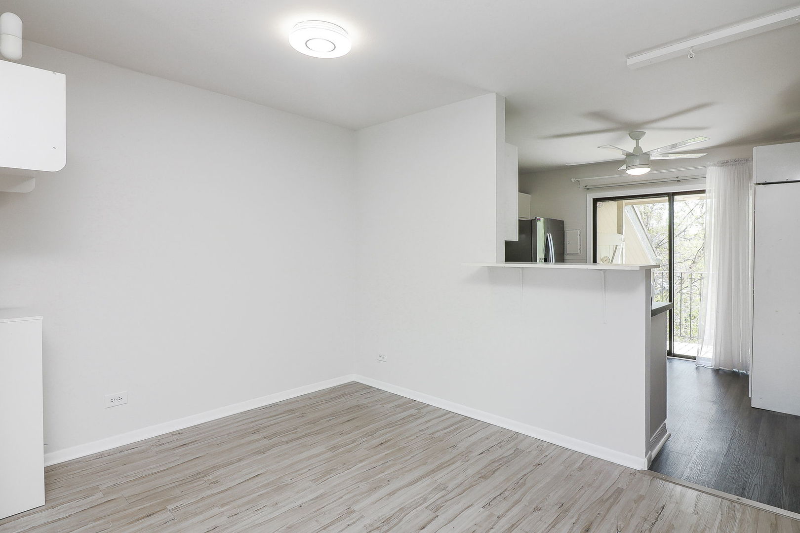 201 North Waters Edge Drive, Unit 302 Glendale Heights, IL 60139 - Photo 8 of 18 wooden floor in an empty room