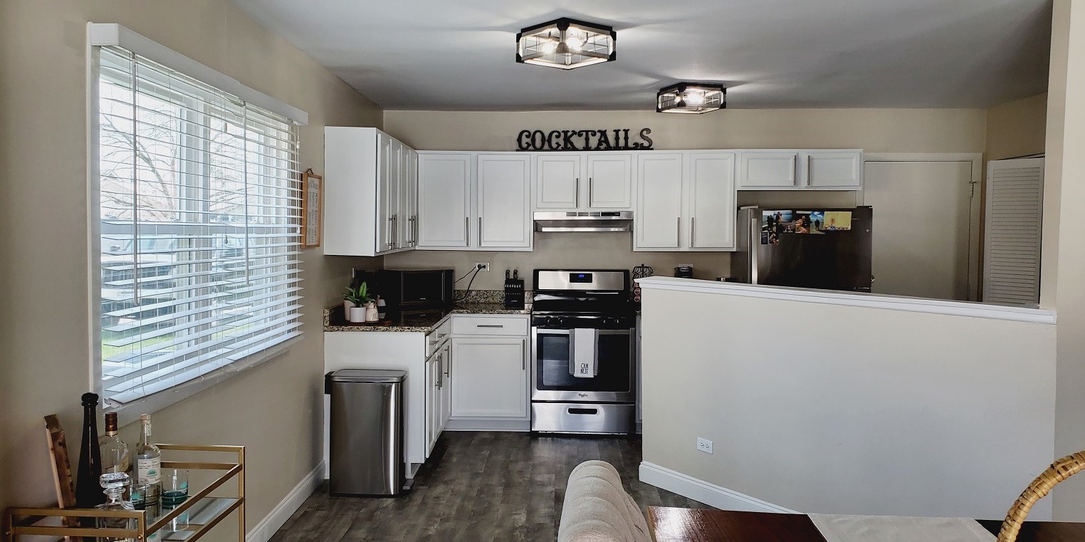 660 Niagara Drive Bolingbrook, IL 60440 - Photo 12 of 28 a kitchen with a refrigerator and a stove