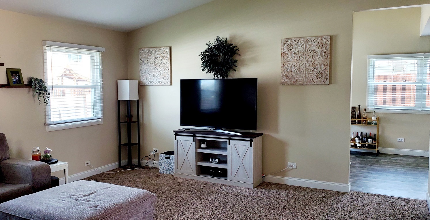 660 Niagara Drive Bolingbrook, IL 60440 - Photo 3 of 28 a living room with furniture and a flat screen tv