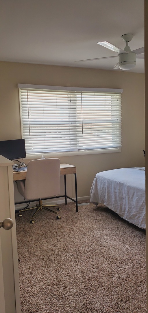 660 Niagara Drive Bolingbrook, IL 60440 - Photo 21 of 28 a bedroom with a bed and a window