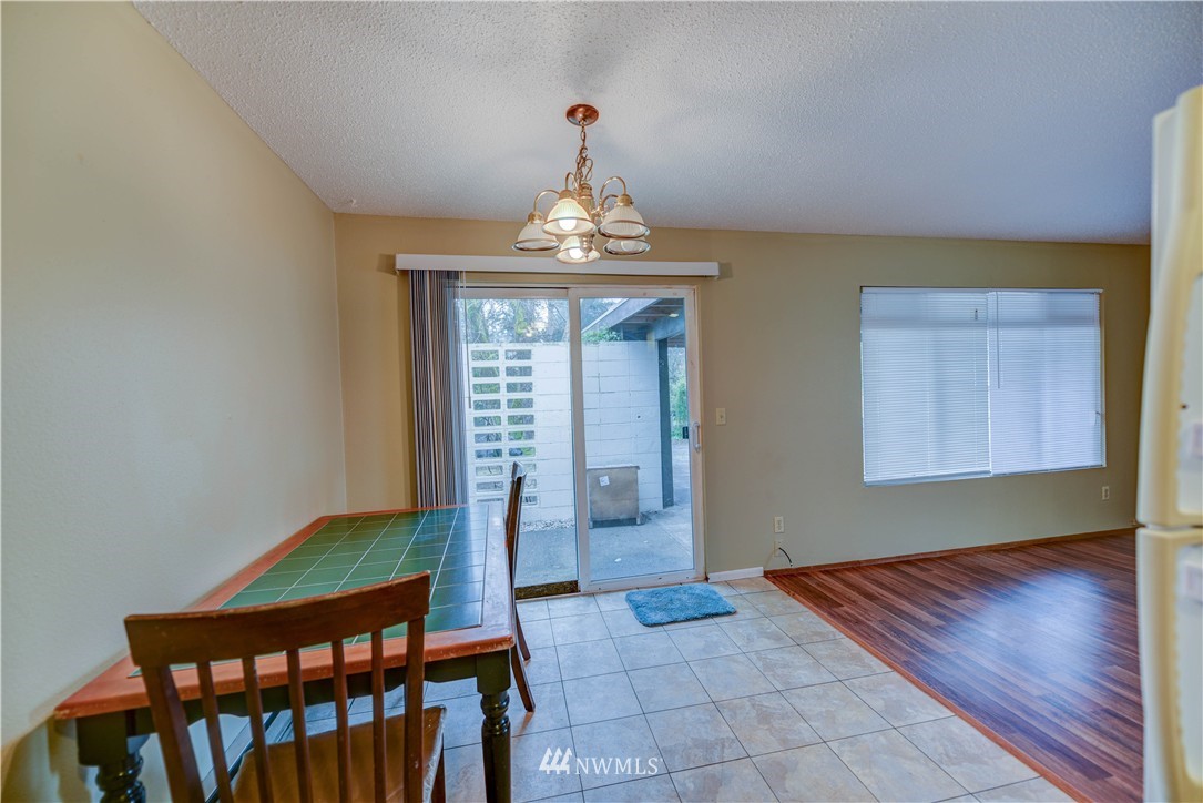 8701-8703 Custer Road Southwest Lakewood, WA 98499 - Photo 14 of 17 a very nice looking room with a large window
