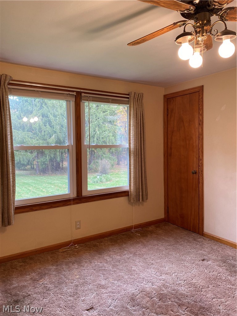 807 Plymouth Ridge Road Ashtabula, OH 44004 - Photo 21 of 34 Bedroom 3 - 11 x 10 with hardwood flooring under carpeting and ceiling fan.