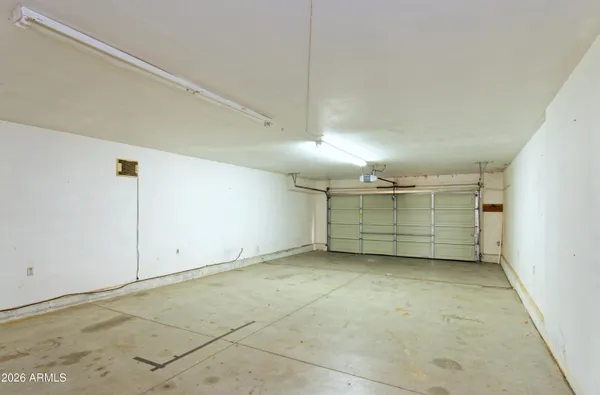 a view of an empty room with windows