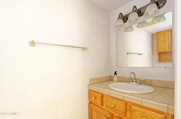 a bathroom with a sink and a mirror