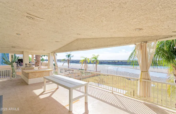 a view of a swimming pool and outdoor seating