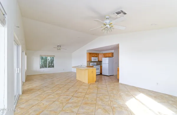 a view of a kitchen with a sink cabinets and a window