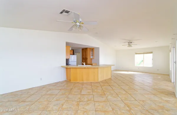 a view of a living room with a window and chandelier
