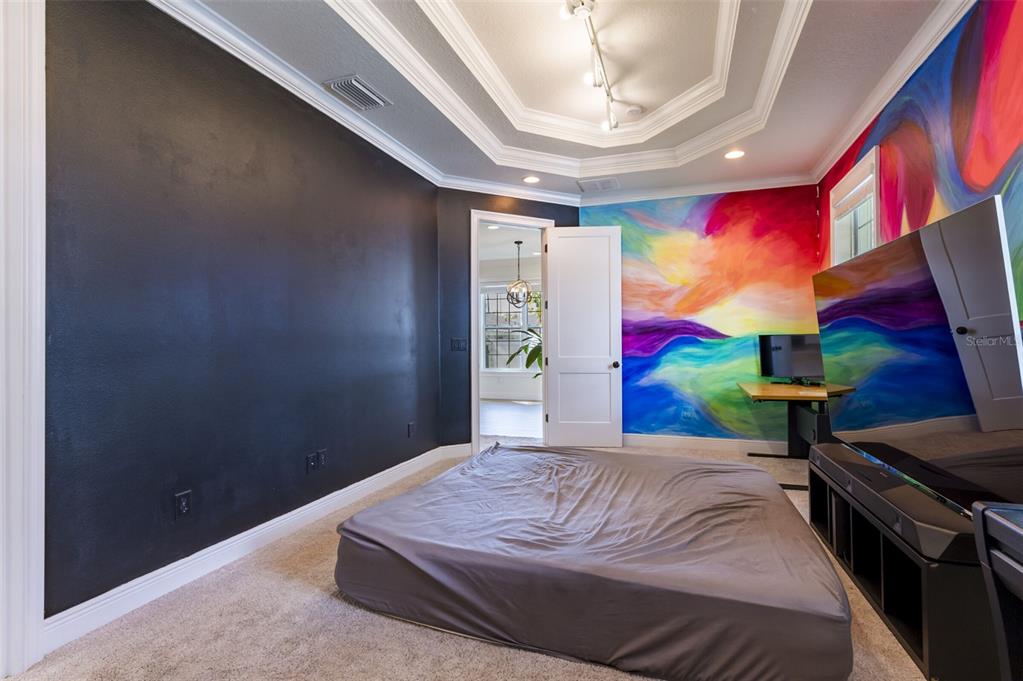 3405 West Cherry Street Tampa, FL 33607 - Photo 21 of 41 a bedroom with a bed and a painting on the wall