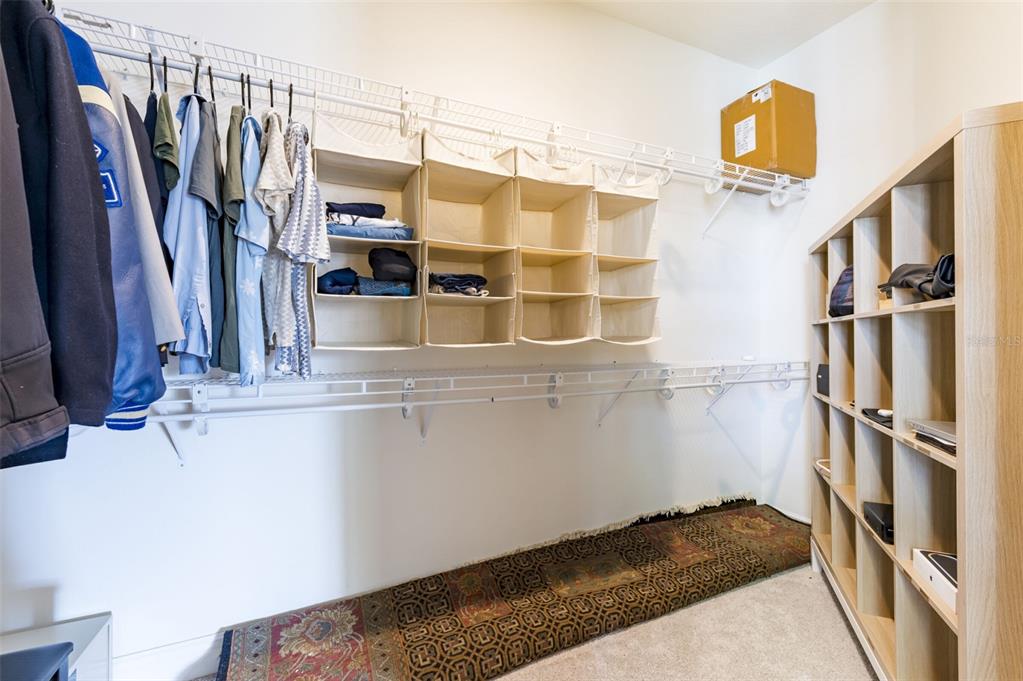 3405 West Cherry Street Tampa, FL 33607 - Photo 23 of 41 a view of walk in closet with clothes and shoes