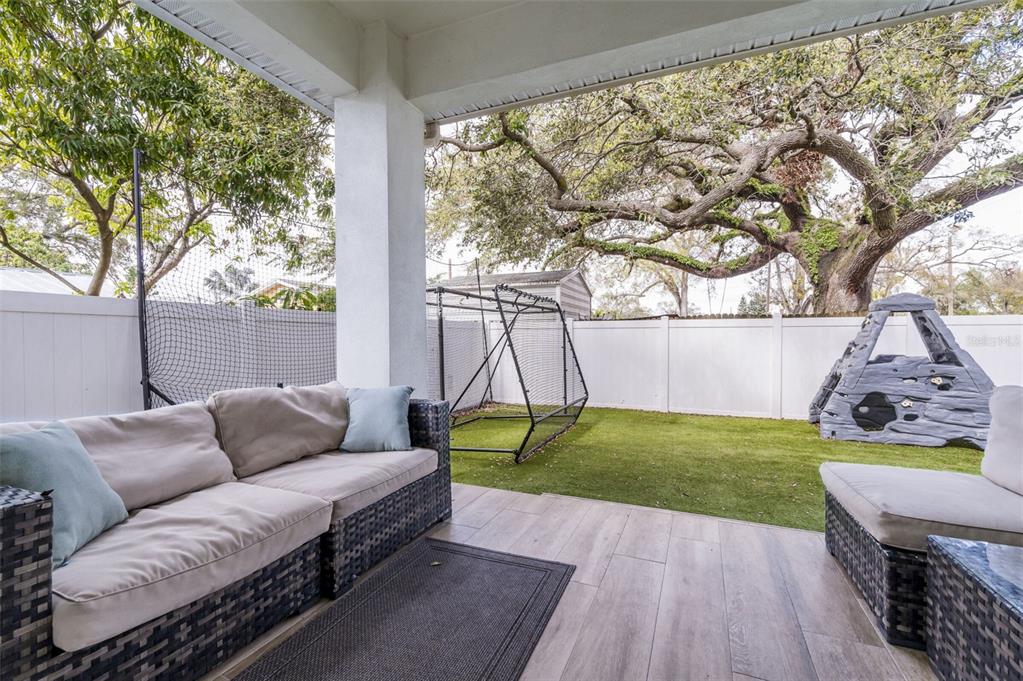 3405 West Cherry Street Tampa, FL 33607 - Photo 33 of 41 a backyard of a house with seating space and trees