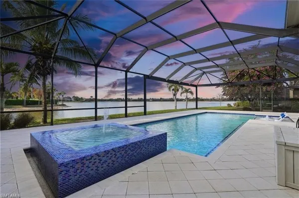 a view of a swimming pool with a patio