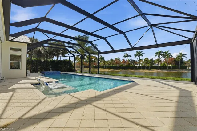 a view of a swimming pool with a patio