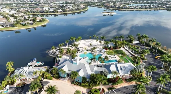an aerial view of a house with a lake view