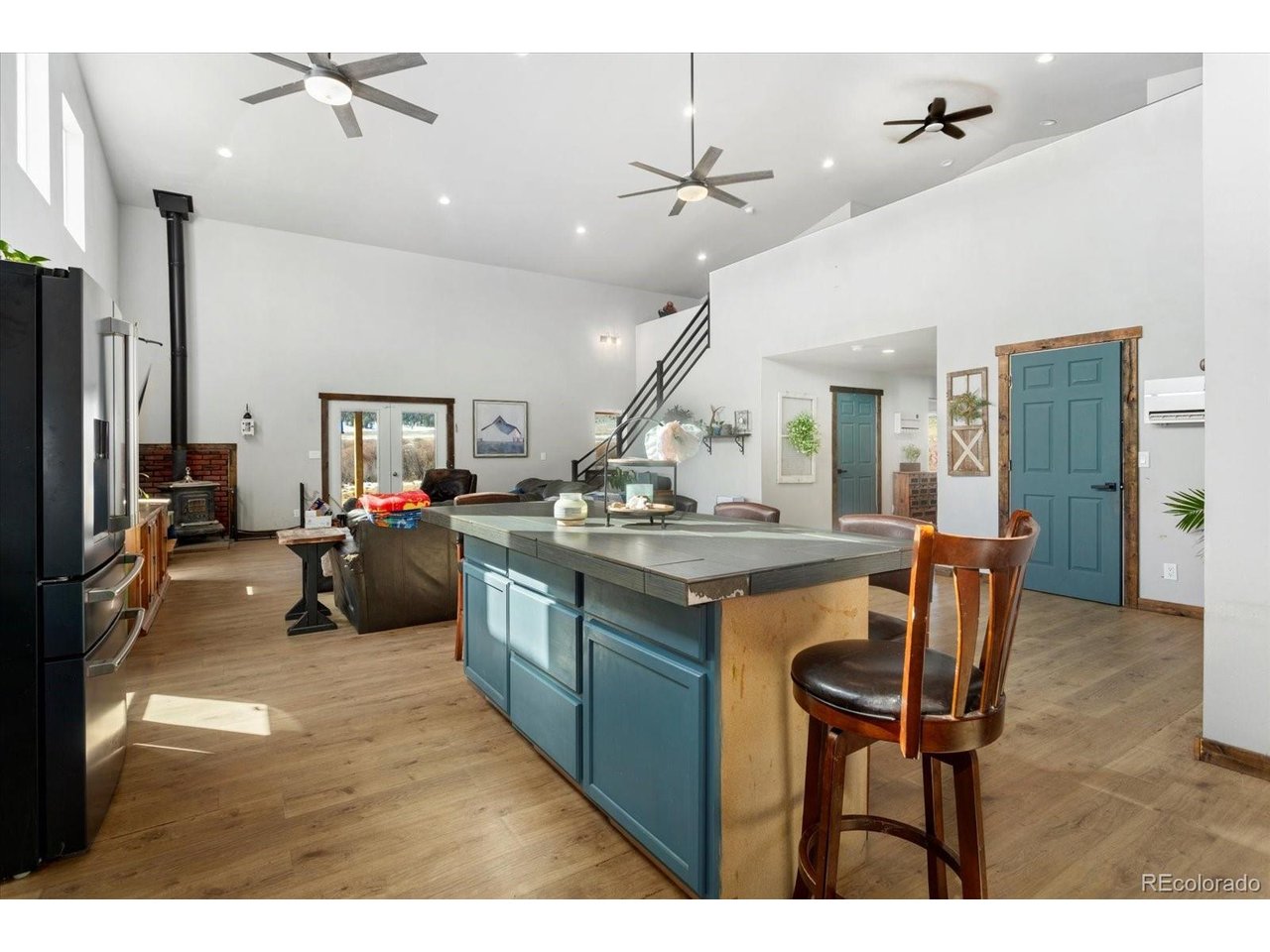 51624 Co Road Villa Grove, CO 81155 - Photo 11 of 50 a view of living room with kitchen island furniture and a chandelier
