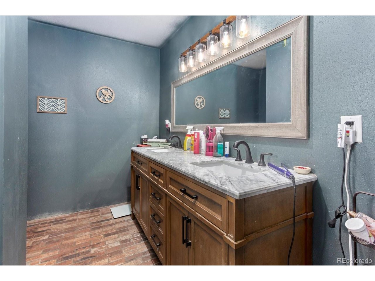 51624 Co Road Villa Grove, CO 81155 - Photo 16 of 50 a bathroom with a sink vanity and a mirror