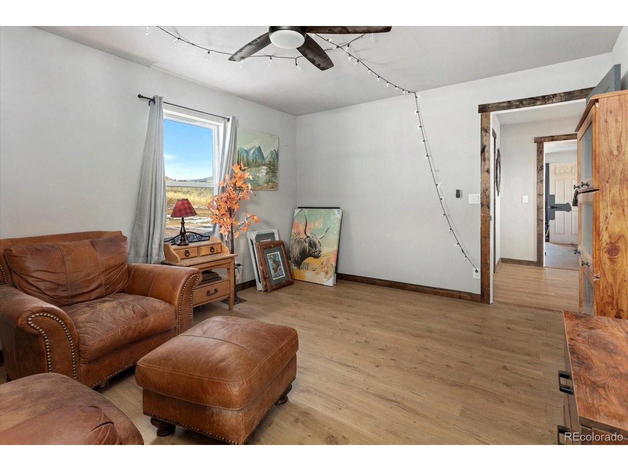 51624 Co Road Villa Grove, CO 81155 - Photo 19 of 50 a living room with furniture and a flat screen tv