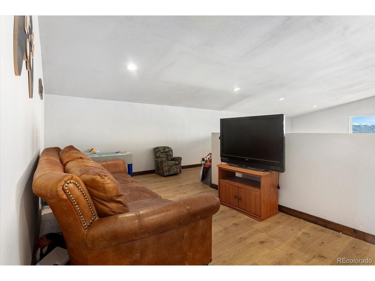 51624 Co Road Villa Grove, CO 81155 - Photo 24 of 50 a living room with furniture and a flat screen tv