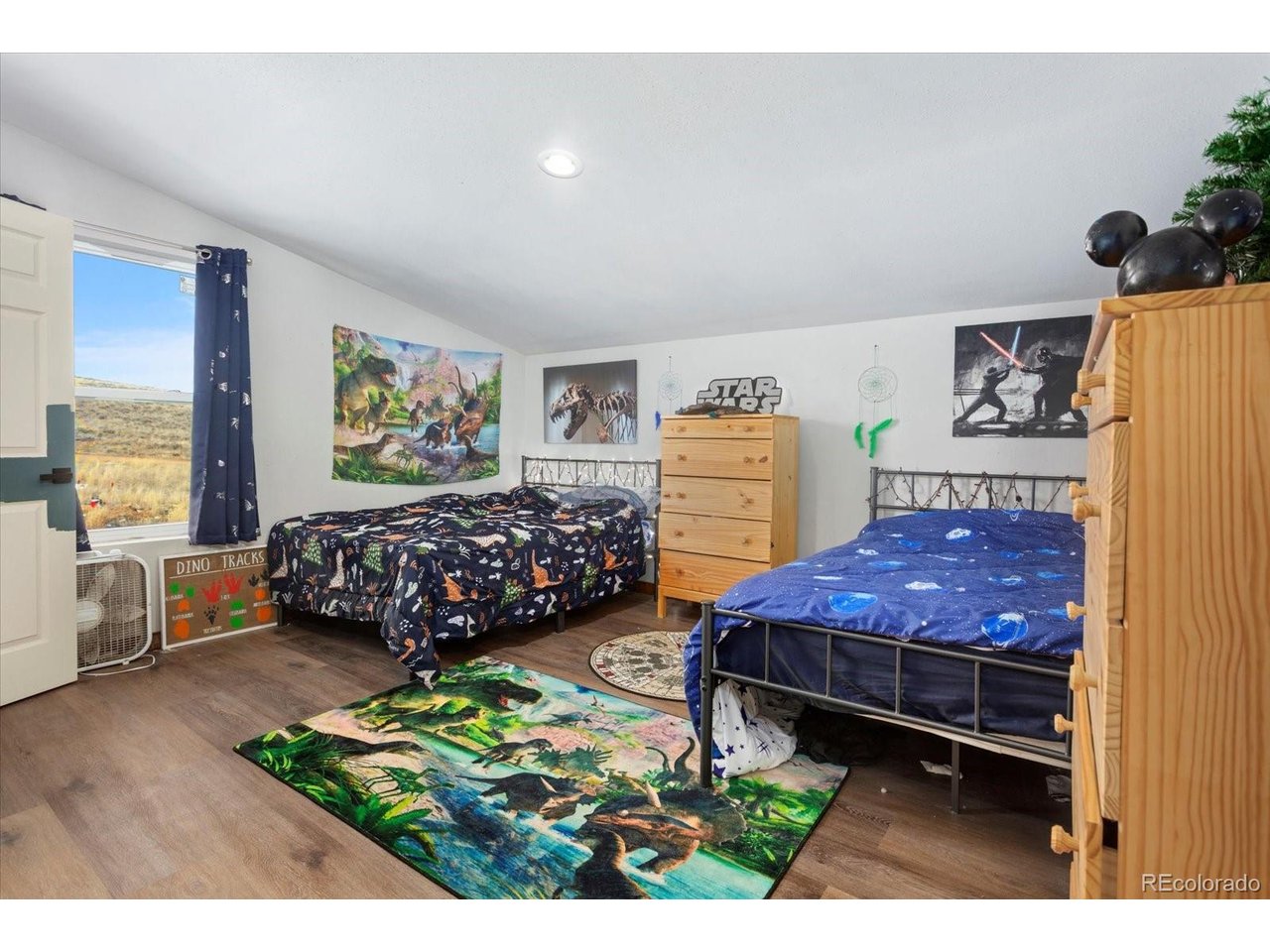 51624 Co Road Villa Grove, CO 81155 - Photo 25 of 50 a bed room with a bed window and a dresser