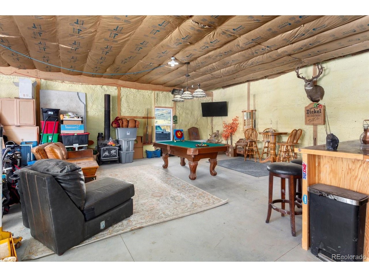 51624 Co Road Villa Grove, CO 81155 - Photo 32 of 50 a living room with furniture and a flat screen tv