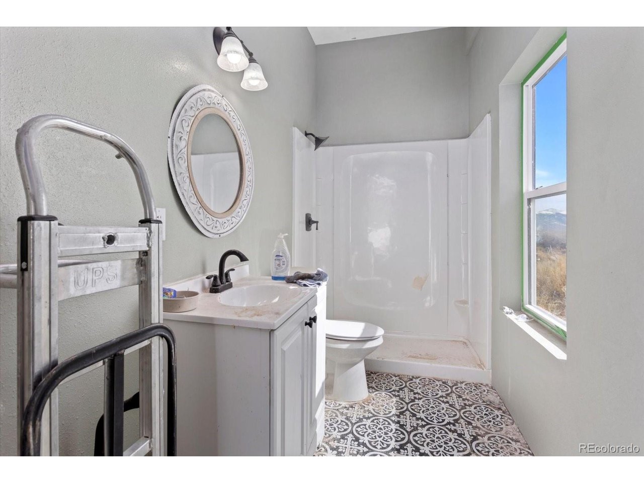 51624 Co Road Villa Grove, CO 81155 - Photo 34 of 50 a bathroom with a sink a toilet and a mirror