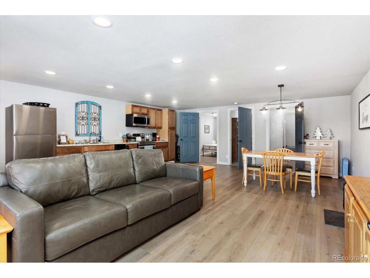 51624 Co Road Villa Grove, CO 81155 - Photo 38 of 50 a living room with furniture and a dining table with kitchen view