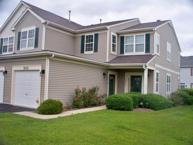 3016 Falling Waters Lane, Unit 3016 Lindenhurst, IL 60046 - Photo 1 of 21 a view of a house with a yard