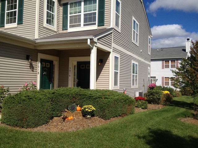 3016 Falling Waters Lane, Unit 3016 Lindenhurst, IL 60046 - Photo 2 of 21 a view of a house with a yard and sitting area