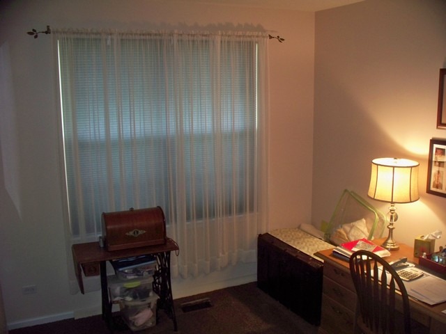 3016 Falling Waters Lane, Unit 3016 Lindenhurst, IL 60046 - Photo 13 of 21 a bedroom with a bed and a table in it