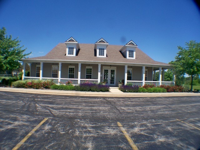 3016 Falling Waters Lane, Unit 3016 Lindenhurst, IL 60046 - Photo 15 of 21 a front view of a house with a yard